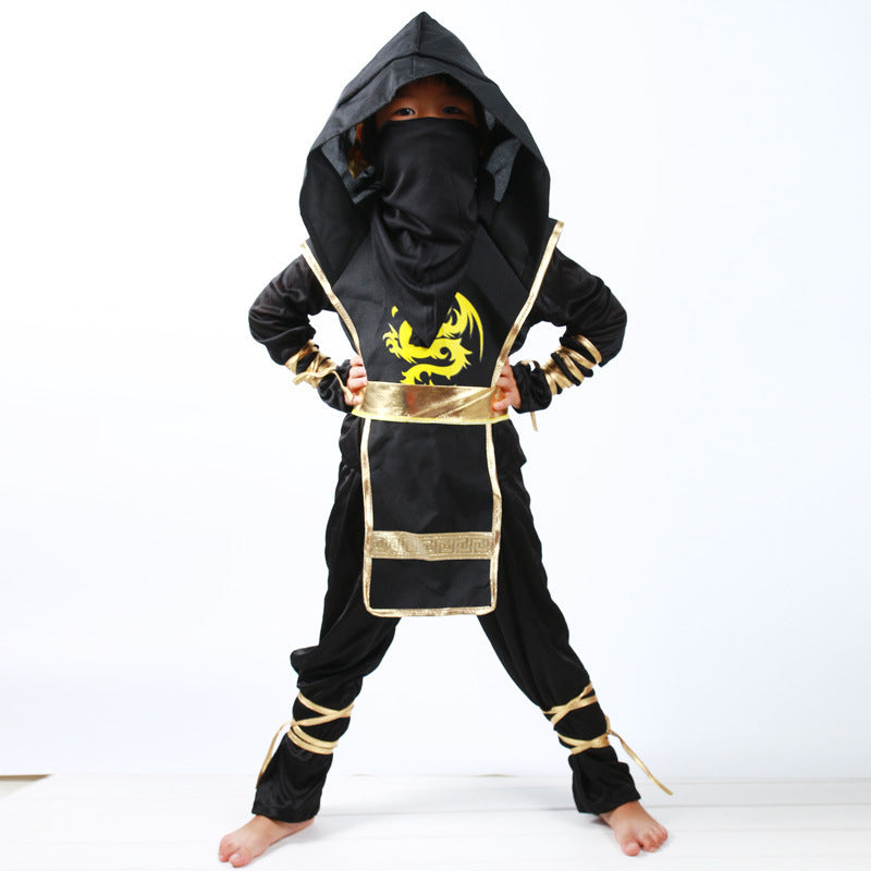 Child wearing a black and gold ninja costume with a dragon design on a white background