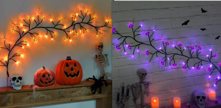 Halloween-themed decorations with pumpkins, skulls, and skeletons on a mantel against a wall with lit branches.