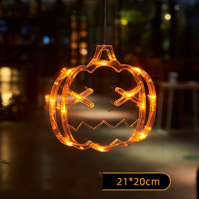 Decorative pumpkin-shaped light with glowing orange LEDs on a dark background