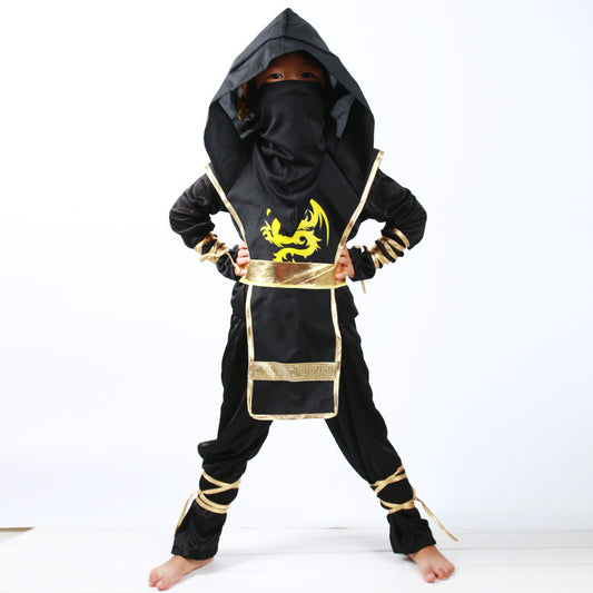 Child wearing a black and gold ninja costume with a dragon design on a white background