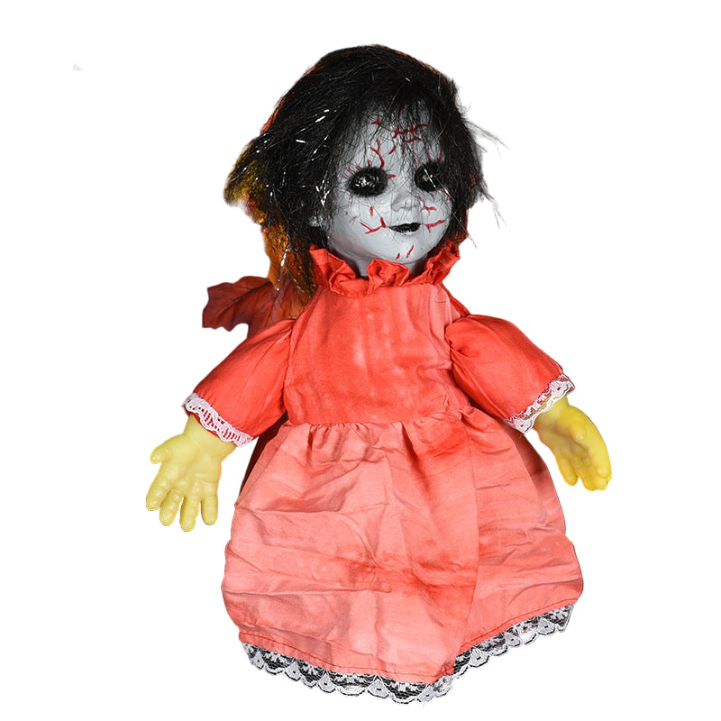 Horror-themed doll with a red dress and yellow gloves on a dark background with leaves and spider webs.