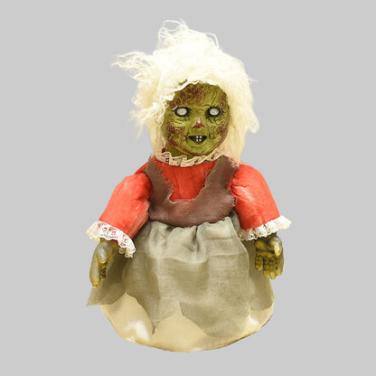Horror-themed doll with measurements on a plain background