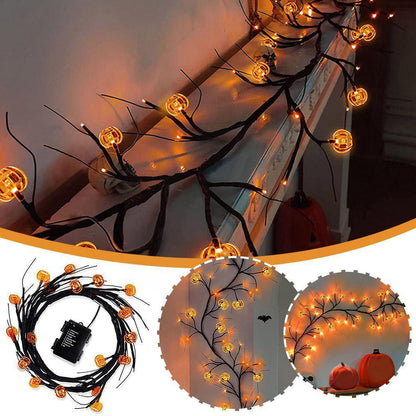 Halloween-themed string lights with pumpkins and a bat on a dark background