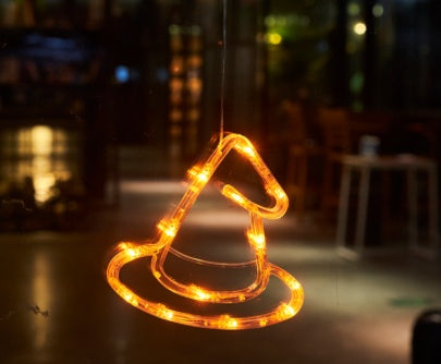 Decorative LED witch hat light on a blurred background