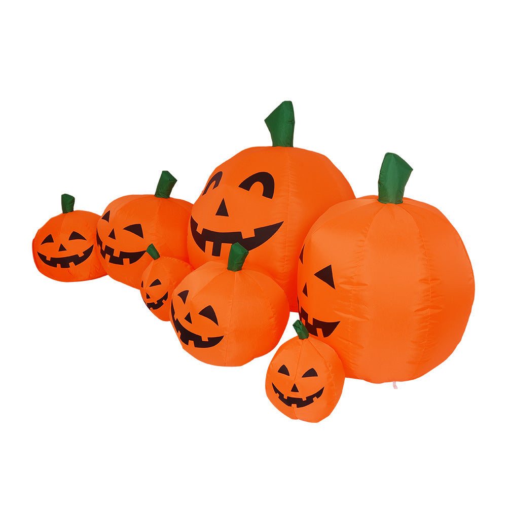 Set of inflatable pumpkins with jack-o'-lantern faces on a white background