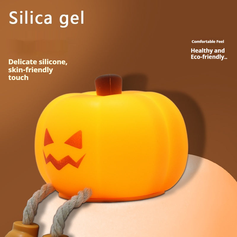 Pumpkin-shaped pillow with a carved face on a brown background, labeled 'Silica gel'.