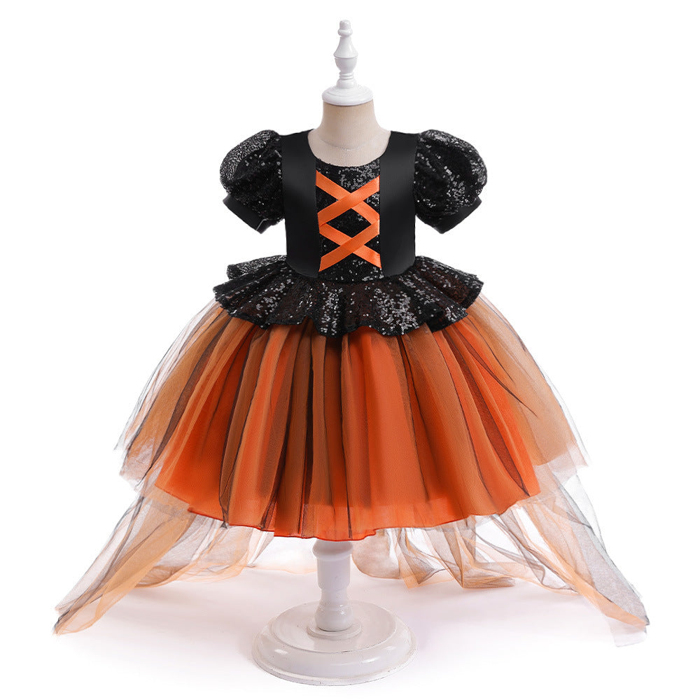 Children's Halloween dress with black top and orange skirt on a mannequin against a white background