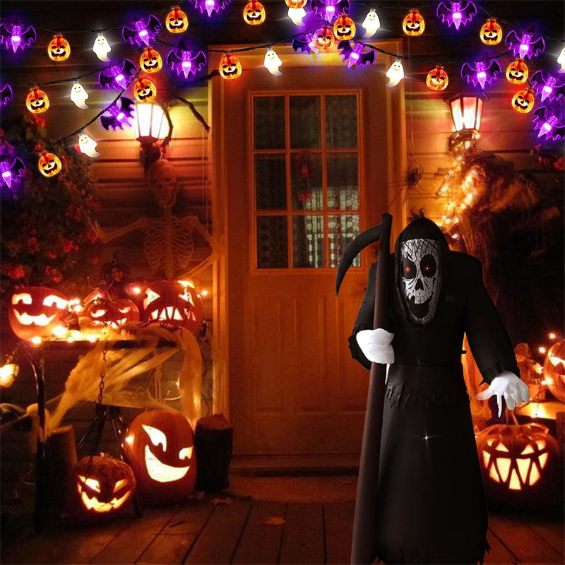 Person in a Halloween costume standing in front of a decorated porch with pumpkins and lights.