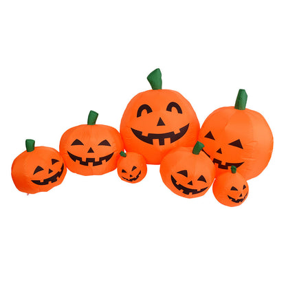 Set of inflatable pumpkins with jack-o'-lantern faces on a white background