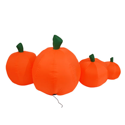 Set of inflatable orange pumpkins with green stems on a white background