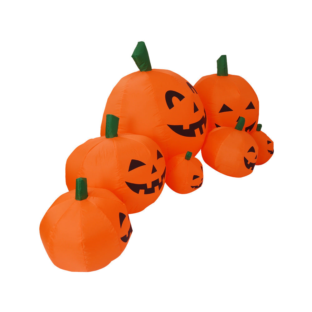 Set of inflatable pumpkins with jack-o'-lantern faces on a white background