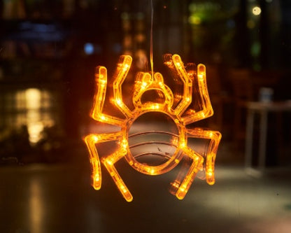 Spider-shaped LED light decoration with a blurred background